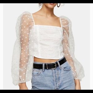 long sleeve, polka dot shirt with sheer sleeves